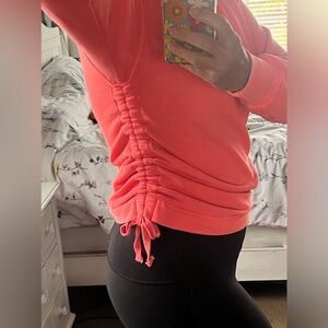 Bright pink/orange Aerie hooded sweatshirt with drawstring scrunchie sides. Xs